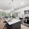 The Beckett apartment kitchen with an island and stainless steel appliances