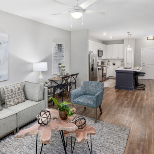 Furnished apartment living room inside a home at The Beckett